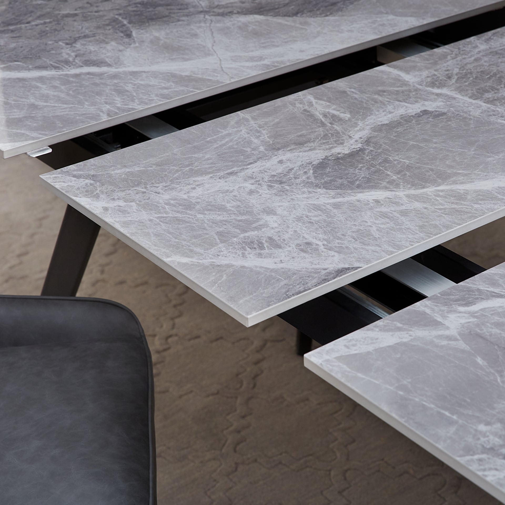 Lucia Extendable Stone Top Metal Leg Dining Table in Piedra and Black - What A Room