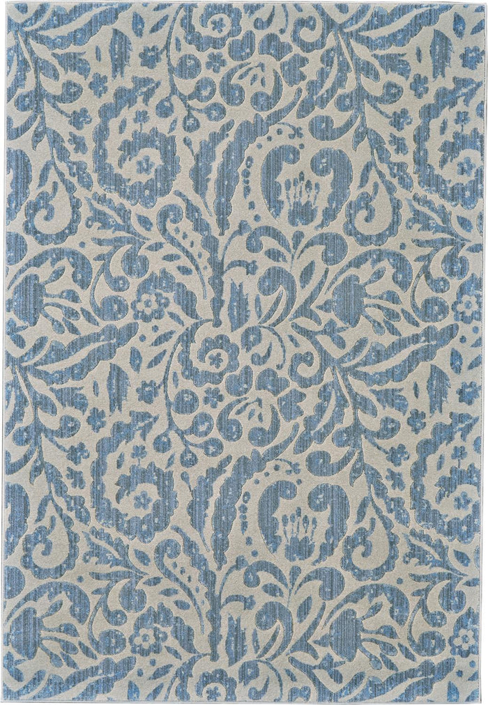 Floral garden design on this muted contemporary rug which uses a blue and natural tan color scheme - What A Room serves the Santa Clara Area for home furnishings and furniture