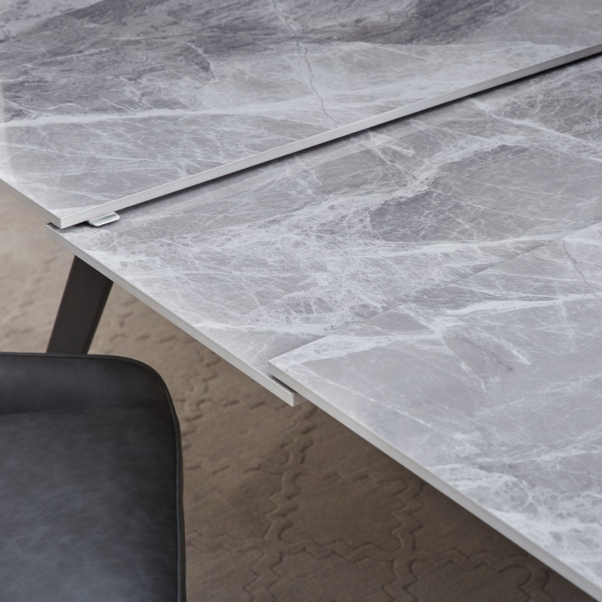 Lucia Extendable Stone Top Metal Leg Dining Table in Piedra and Black - What A Room