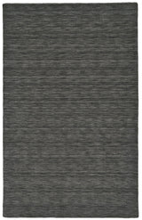 Simple at first glance, this rug has a lot of depth with the charcoal color theme - Available at your local Santa Clara Furniture store