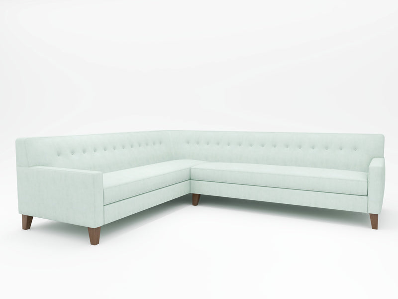 A Sectional Sofa in an incredibly light blue color tone