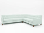 Light colored Sectional with wooden feet