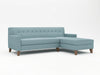 Light blue L-shaped chaise with medium wood feet