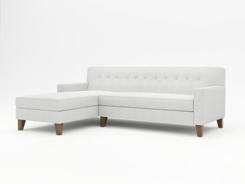 Stark white with heather grey upholstery on a mid-century styled chaise sofa