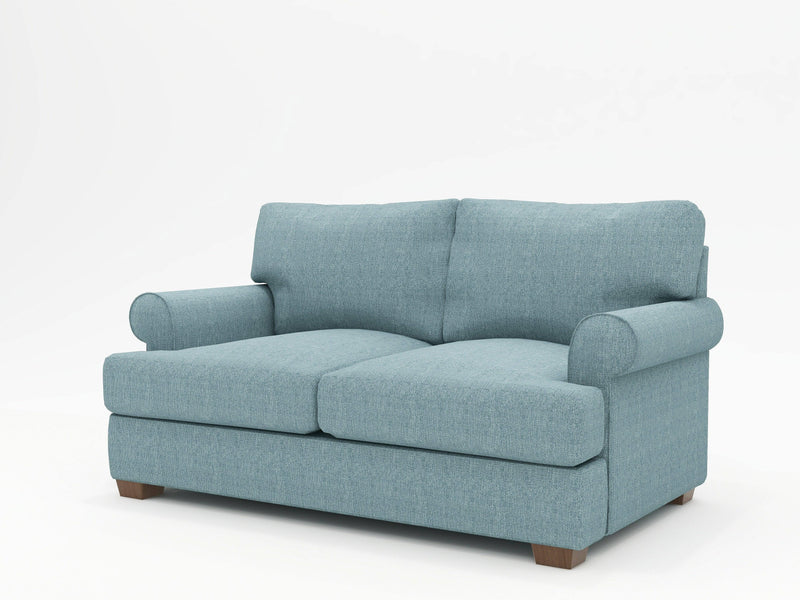Moderate blue color gives a contemporary flair to a more traditionally styled custom made sofa