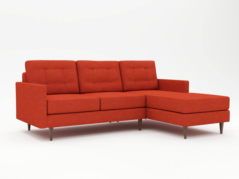Eclectic deep orange couch with a chaise return on the right side as viewing from the front