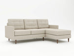 Upright stance sofa chiase with spindle style feet in wood