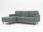 A higher profile stance on a grey modern styled sofa with a left hand chaise return